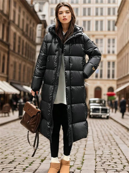 Woman wearing a black puffer coat on a city street