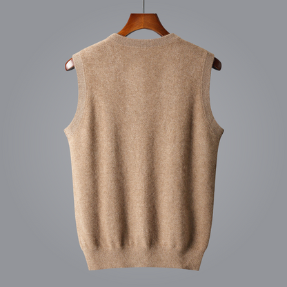 Beige sweater vest on a wooden hanger against a gray background