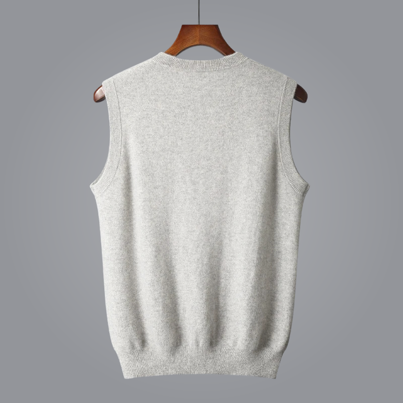 Gray sleeveless sweater vest on a hanger against a gray background