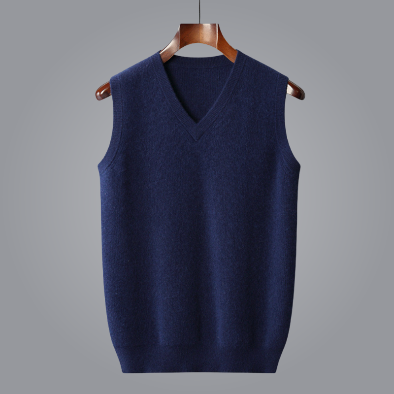 Blue sweater vest on a hanger against a gray background