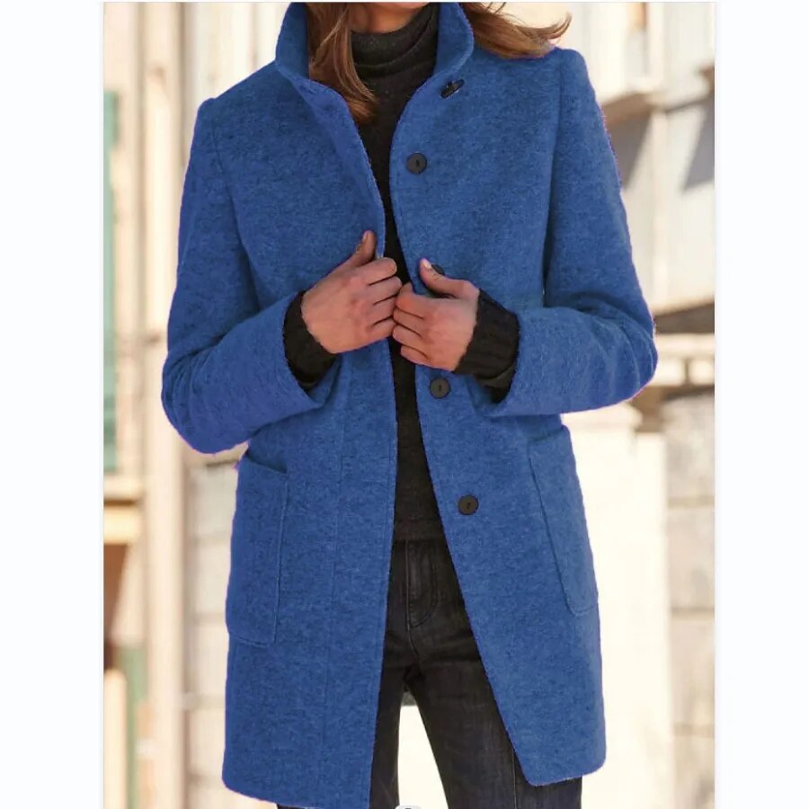 Blue coat worn by a person with a blurred background