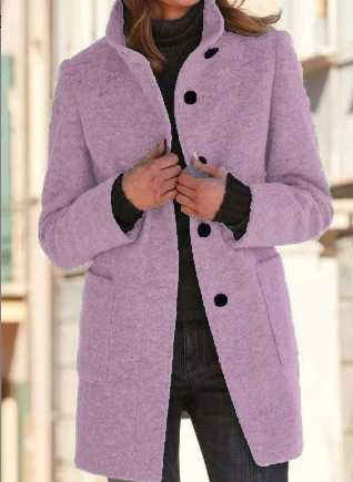 Person wearing a purple coat with black buttons and cuffs.