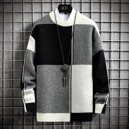 Color-blocked sweater with a key pendant on a grid background