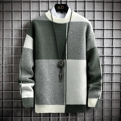 Color-blocked sweater with a brand logo on a grid background