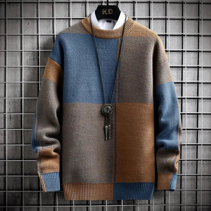 Color-blocked sweater with brown, blue, and gray pattern on a grid background