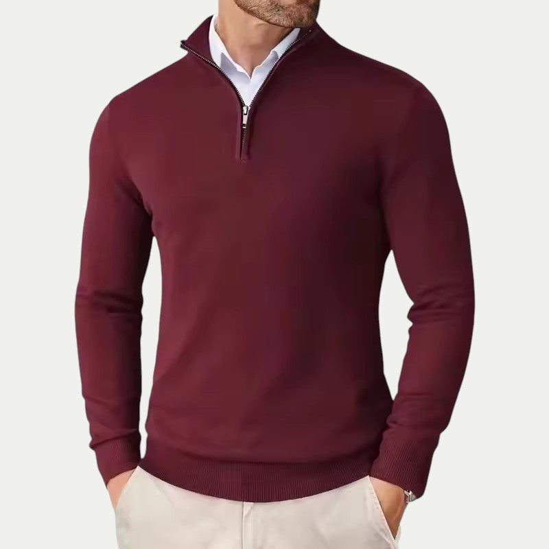 Maroon half-zip sweater worn by a person on a white background