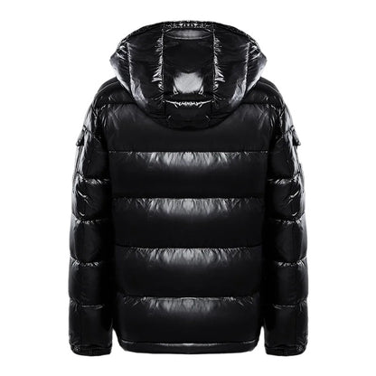 Black puffer jacket with a hood on a white background
