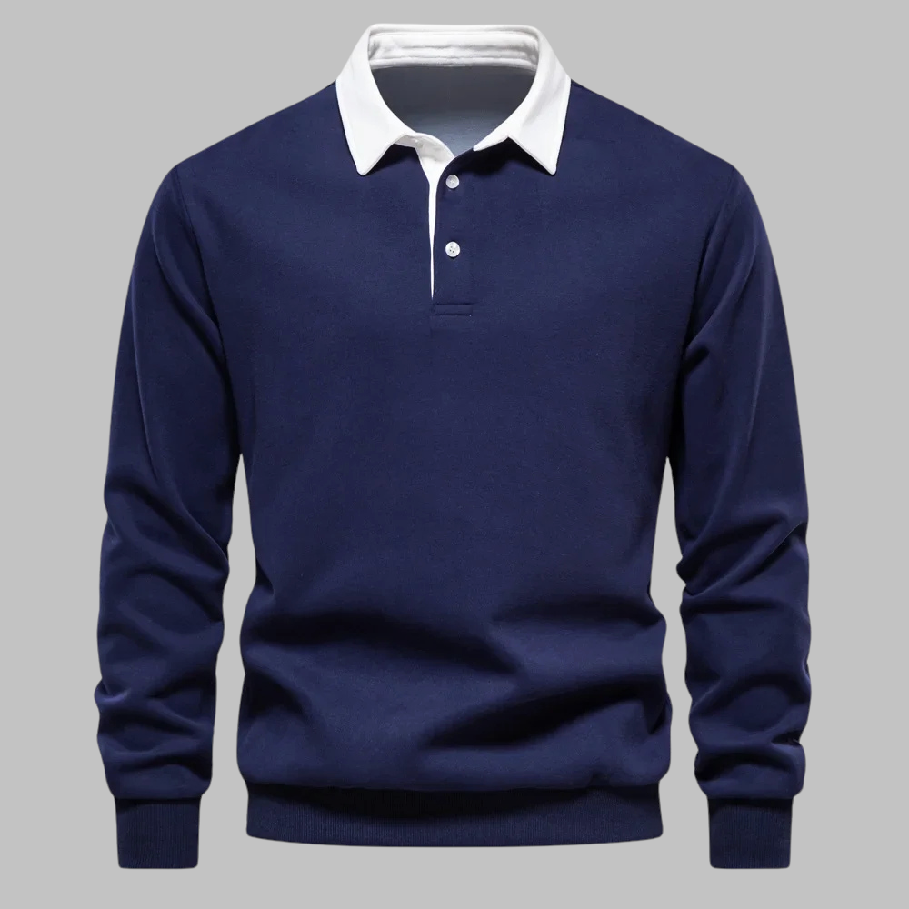 Navy blue sweater with white collar on a gray background