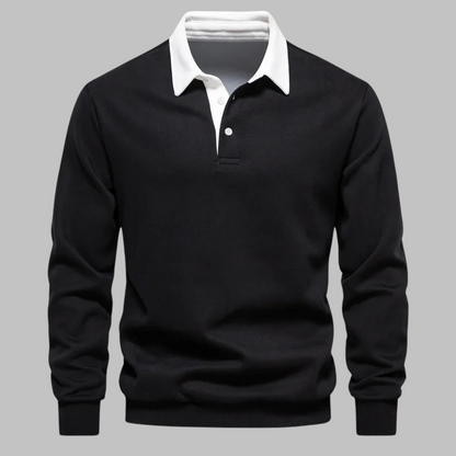 Black sweater with white collar on a gray background