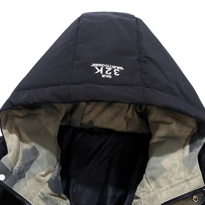 Close-up of a black hooded jacket with camouflage lining on a white background