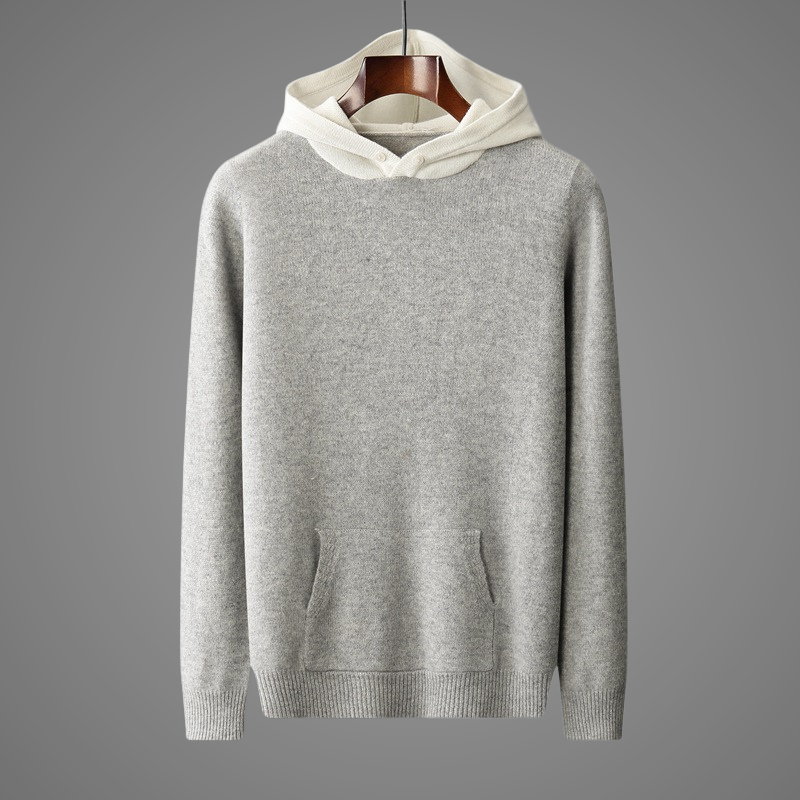 Gray hoodie with white hood on a hanger against a gray background
