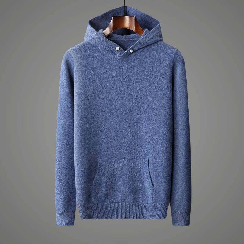 Blue hoodie on a hanger against a gray background