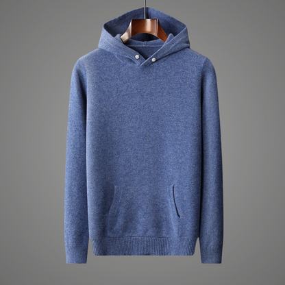 Blue hoodie on a hanger against a gray background