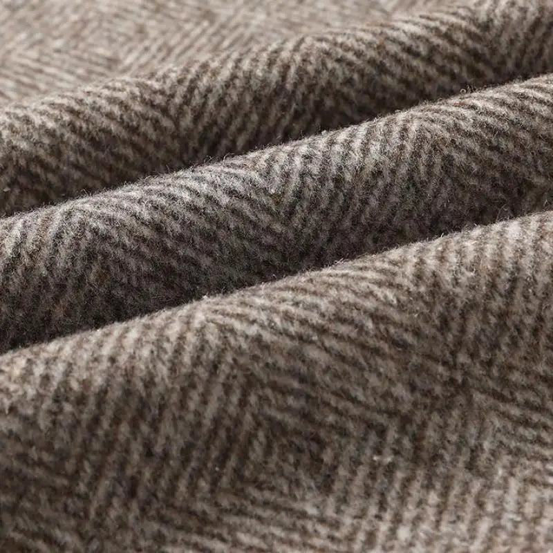 Close-up of textured brown fabric with a subtle pattern
