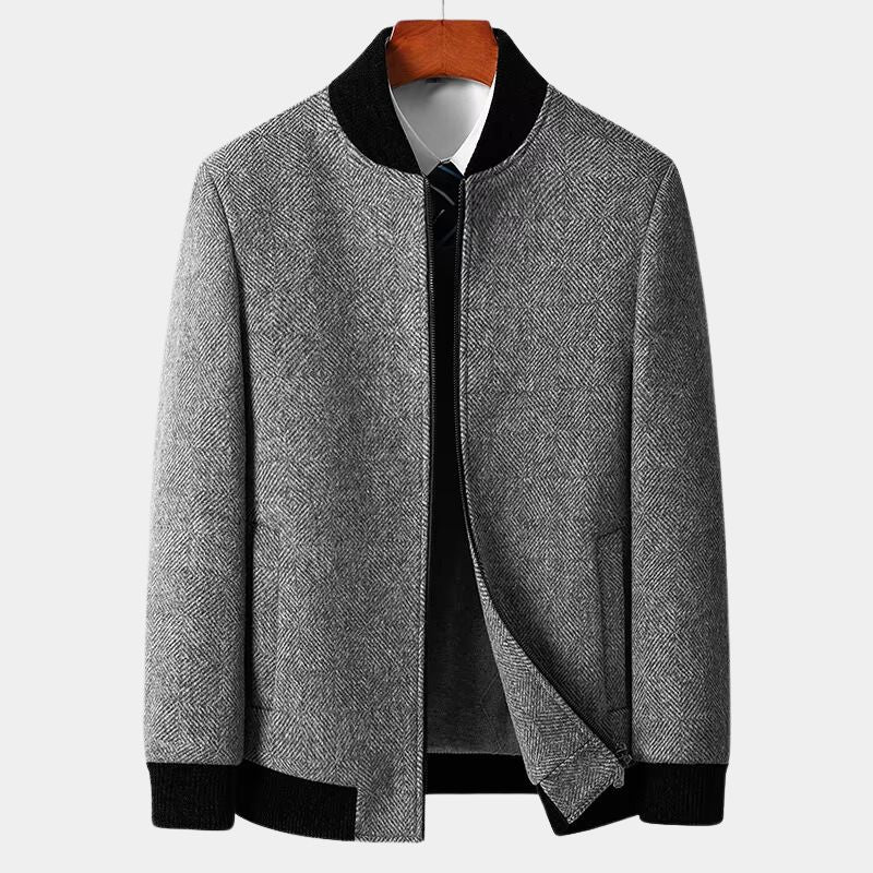Gray textured jacket with black trim on a white background