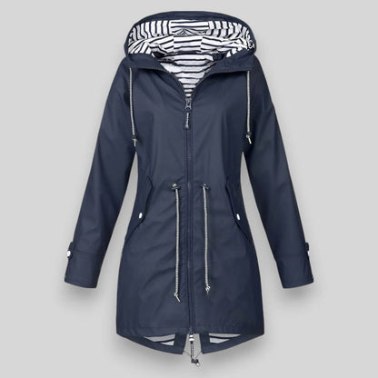 Navy blue raincoat with a striped hood on a light gray background