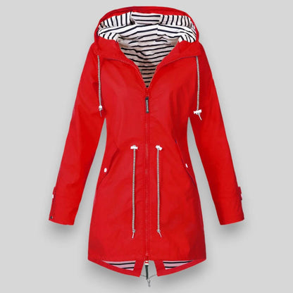 Red raincoat with a striped lining on a gray background