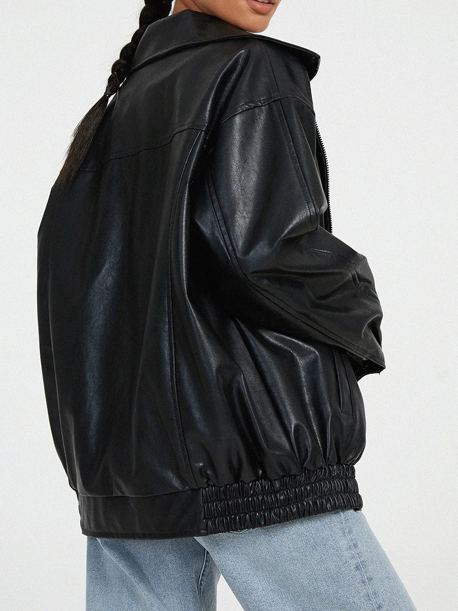 Black leather jacket worn by a person on a white background