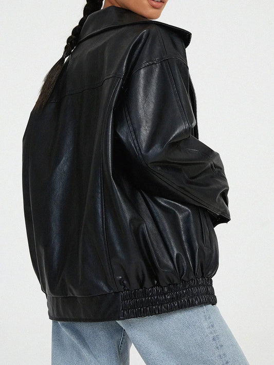 Black leather jacket worn by a person on a white background