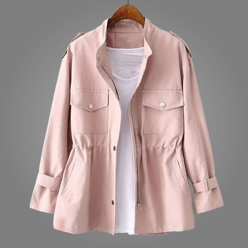 Pink jacket on a hanger against a gray background