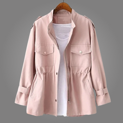 Pink jacket on a hanger against a gray background