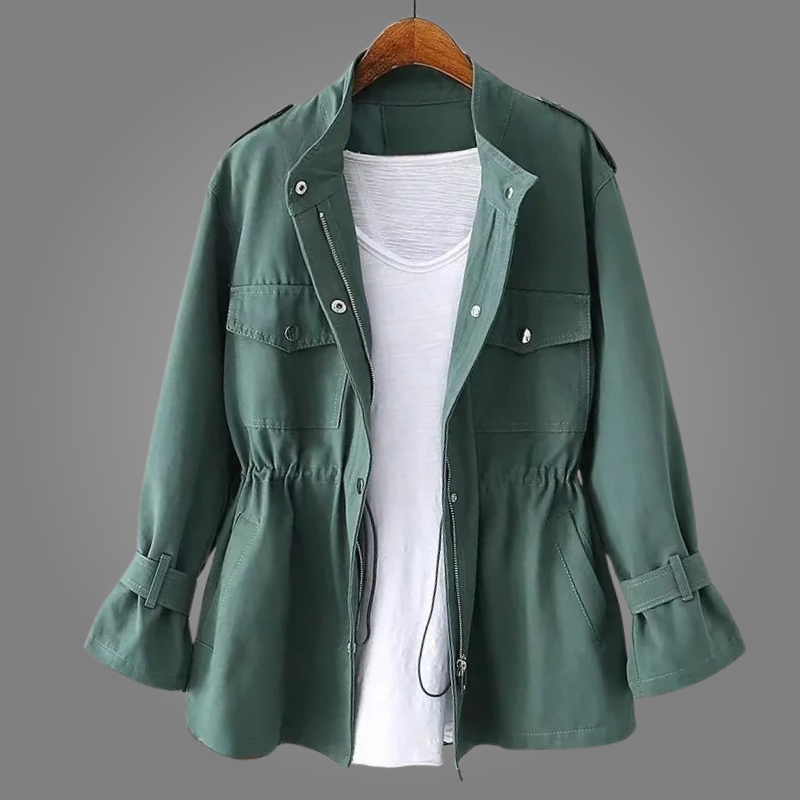 Green jacket on a hanger against a gray background