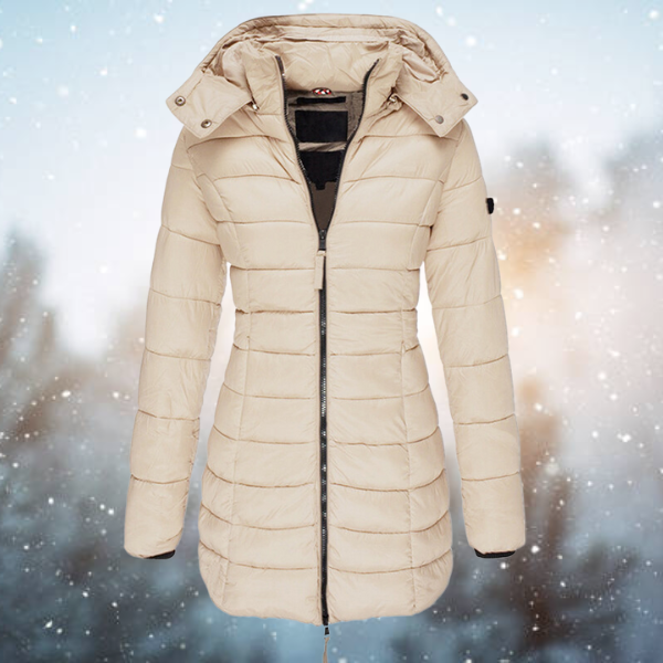 Beige puffer jacket on a snowy background
