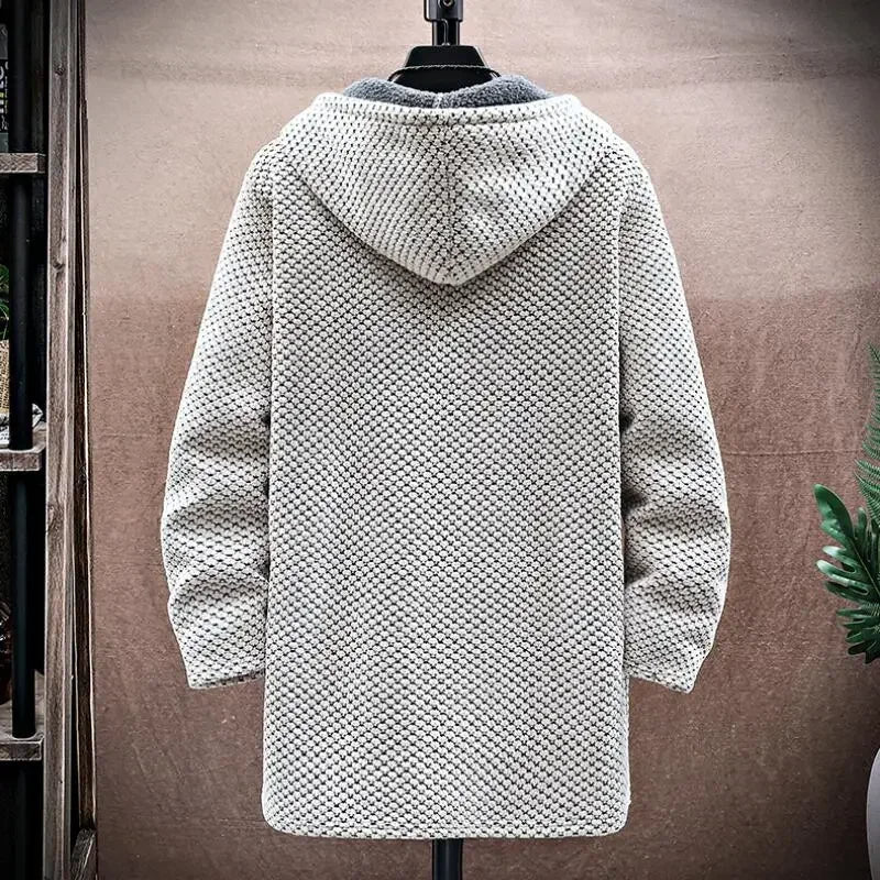 Textured hooded coat on a mannequin against a neutral background