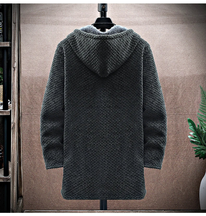 Dark gray textured coat on a mannequin against a neutral background