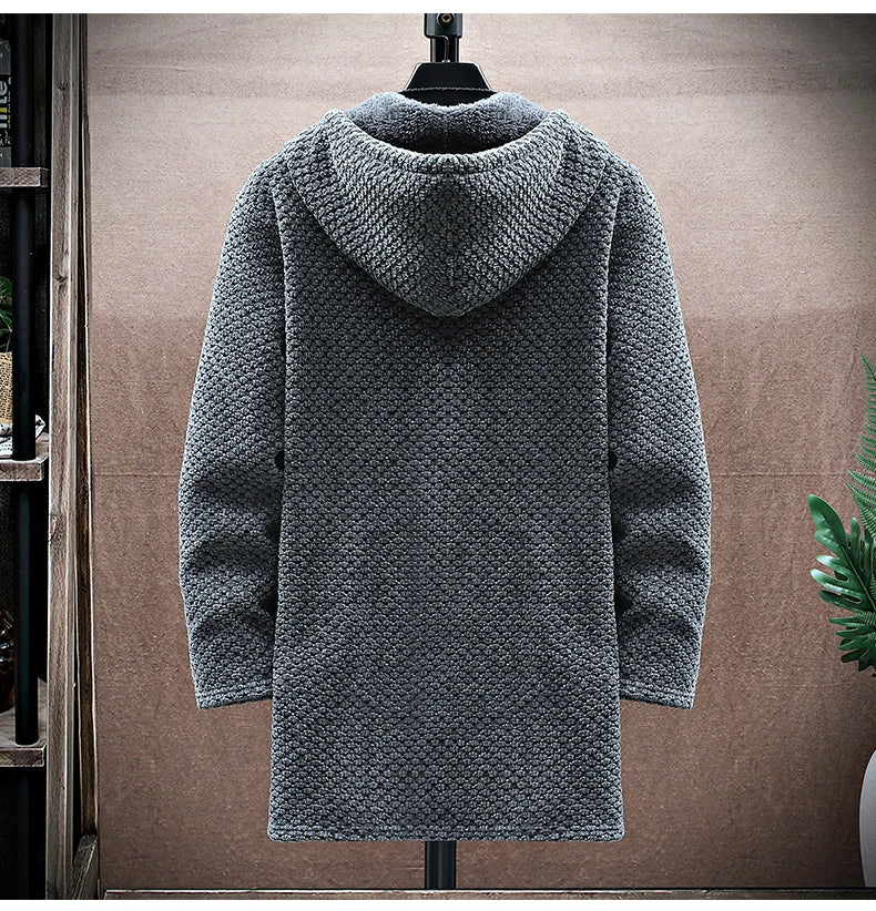 Gray knitted hoodie on a mannequin against a neutral background