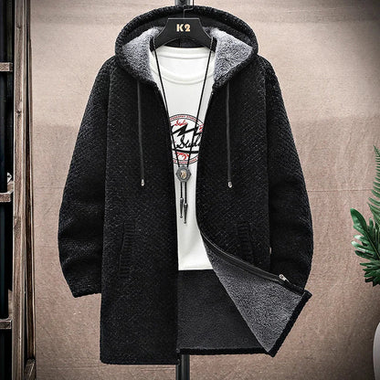 Black hooded jacket with gray lining on a hanger against a neutral background